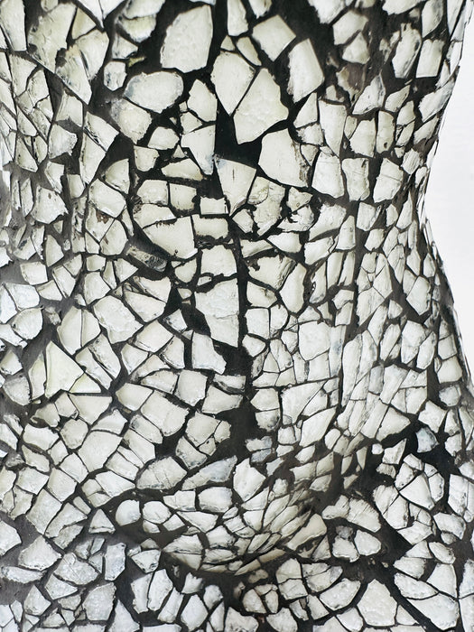 Close-up of hand-painted silver mosaic glass texture on a handcrafted bust lamp.