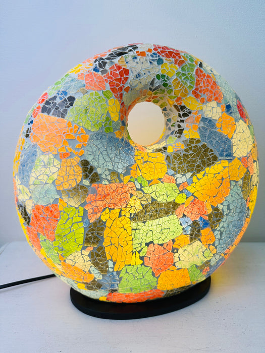 Mosaic Donut Lamp Medium – Crackle Multi photographed in daylight, showing colourful mosaic glass design on a black base