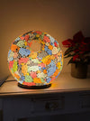 Mosaic Donut Lamp Medium – Crackle Multi illuminated, handmade mosaic lamp with rainbow-coloured glass giving a warm ambient glow