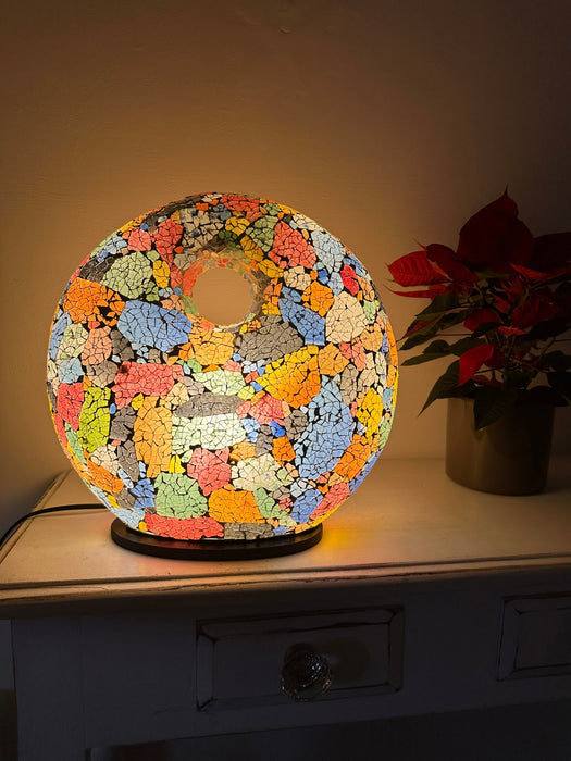 Mosaic Donut Lamp Medium – Crackle Multi illuminated, handmade mosaic lamp with rainbow-coloured glass giving a warm ambient glow