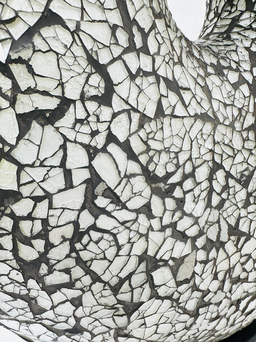 Detailed close-up of silver crackle mosaic glass texture