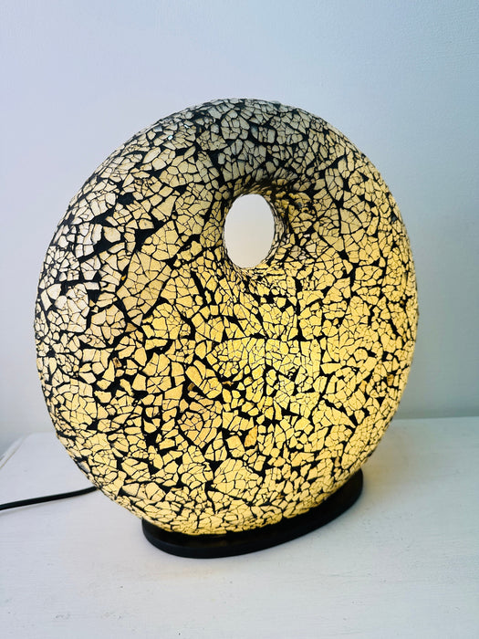 Silver mosaic lamp illuminated, showing warm ambient glow