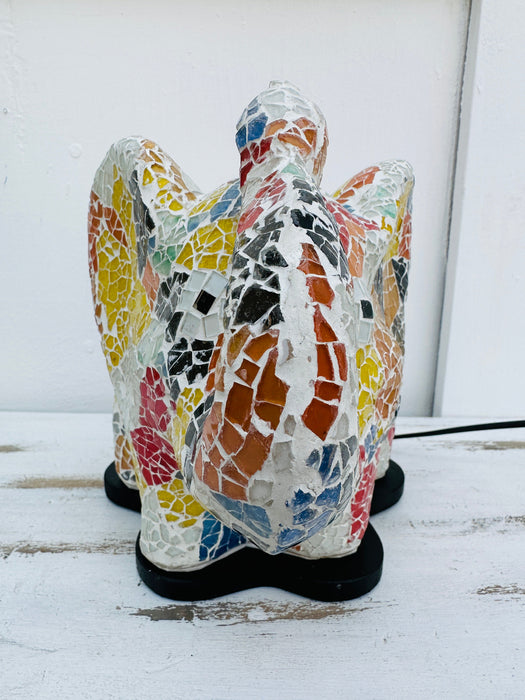 Mosaic elephant lamp top view, colourful glass design and black epoxy base visible on white surface.