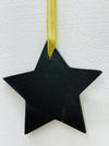 Back of red mosaic star showing black MDF backing and gold mesh ribbon.