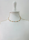 delicate necklace with small multicolour enamel flower charms on a fine chain