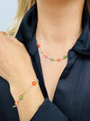 delicate necklace with small multicolour enamel flower charms on a fine chain