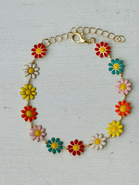 Colorful flower-shaped bracelet on a light gray background