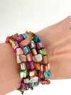 An artful combination of multi coloured shell set on flexible wire, displayed on a model.