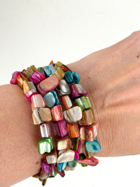 An artful combination of multi coloured shell set on flexible wire, displayed on a model.