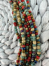 close-up of multicolour glass seed beads from a handmade multistrand necklace