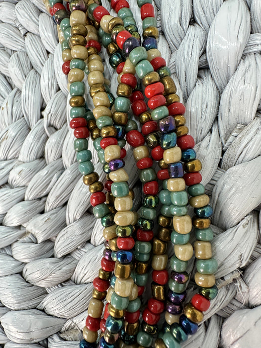 close-up of multicolour glass seed beads from a handmade multistrand necklace