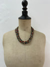 Multicolored beaded necklace on a mannequin 