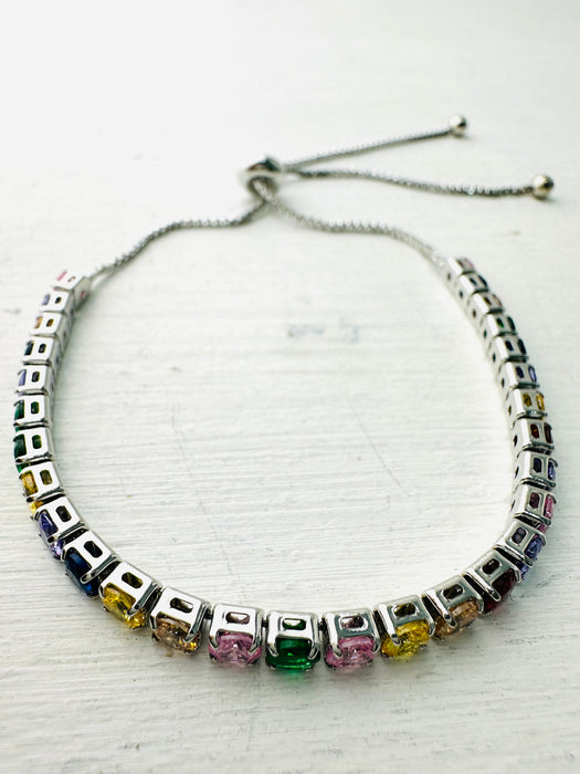 Bracelet with colorful gemstones on a white background