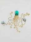 Hand-painted green metal octopus wall decoration with two small fish