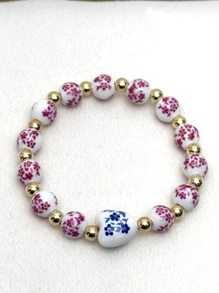 Bracelet with floral beads on a white background