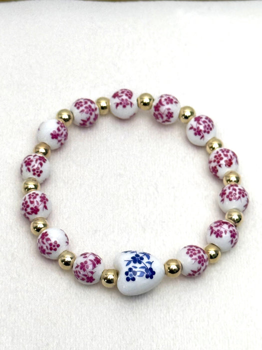 Bracelet with floral beads on a white background