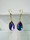 A pair of purple teardrop earrings with gold-colored hooks, displayed against a white background.