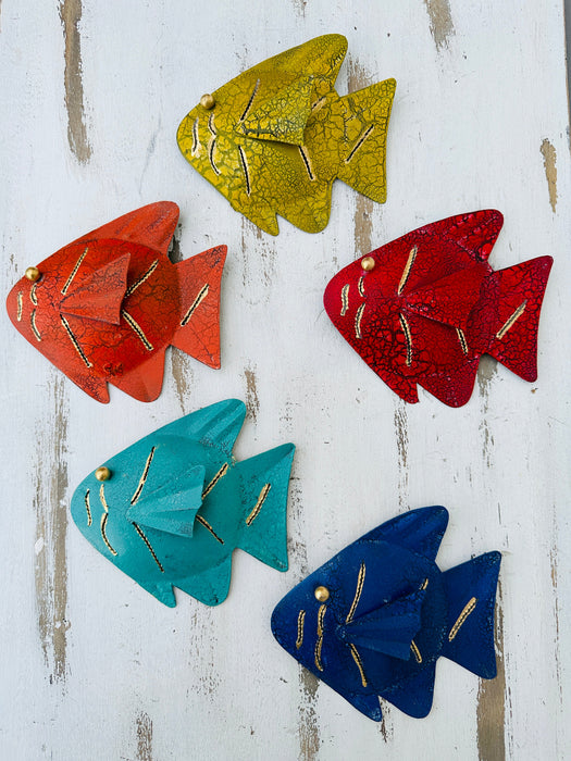 Assorted colourful metal rainbow fish wall art displayed together in multiple colours