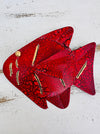 Front view of hand-painted red metal fish showing mottled paint and gold accents
