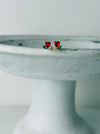 Heart-shaped stud earrings. 