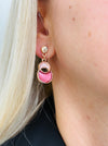 Rose-gold enamel drop earrings with circular design.