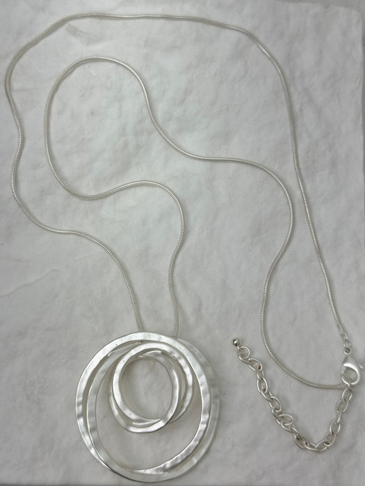silver necklace with layered textured circle pendants