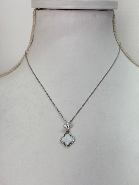silver necklace with clover pendant white enamel and crystal detail