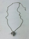 flat lay view of silver heart necklace