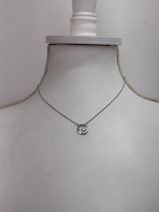 silver necklace with crescent moon an star pendant dainty celestial design.