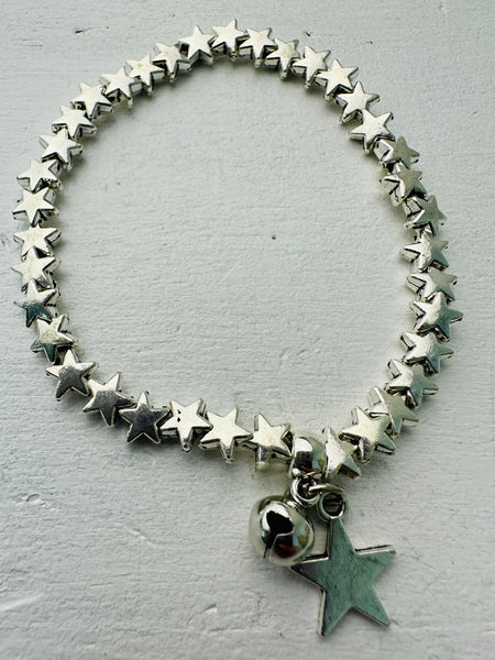 A silver-colored bracelet made up of connected star shapes with a larger star pendant.