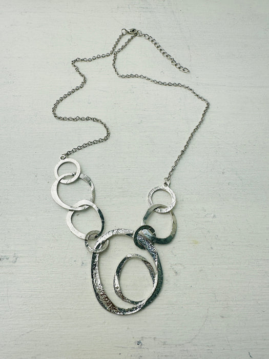 front of silver abstract circle link necklace