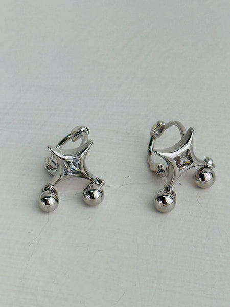 Modern silver tone hoop earrings with square crystal centre and two silver ball accents.