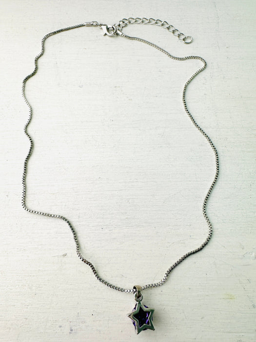 silver tone necklace with small star pendant