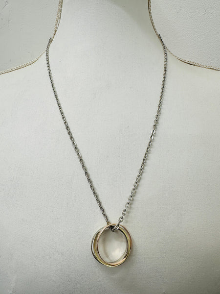 Silver chain necklace with three interlinked mixed metal rings in gold, rose gold, and silver colours