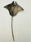 Back view of recycled metal manta ray wall art with subtle metallic finish.