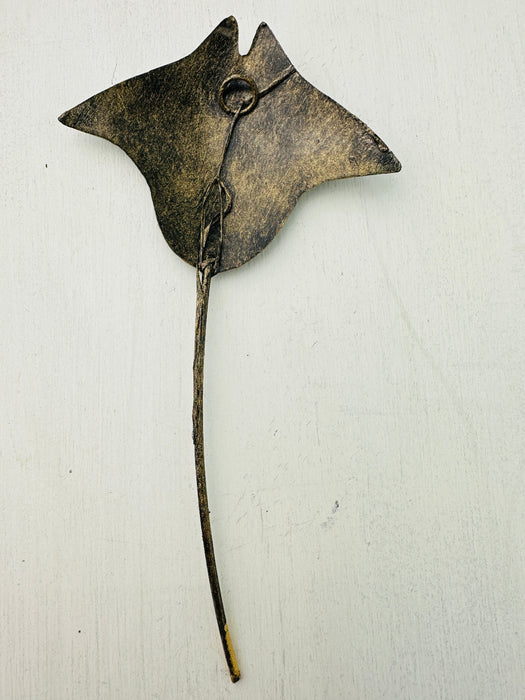 Back view of recycled metal manta ray wall art with subtle metallic finish.