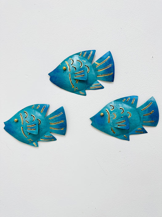 Three turquoise metal reef fish wall decorations displayed together