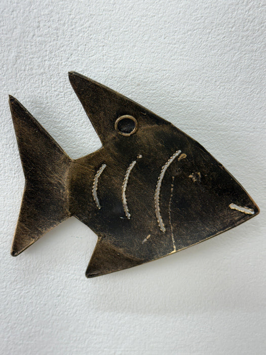 Side angle close-up of copper zebra fish recycled metal wall art