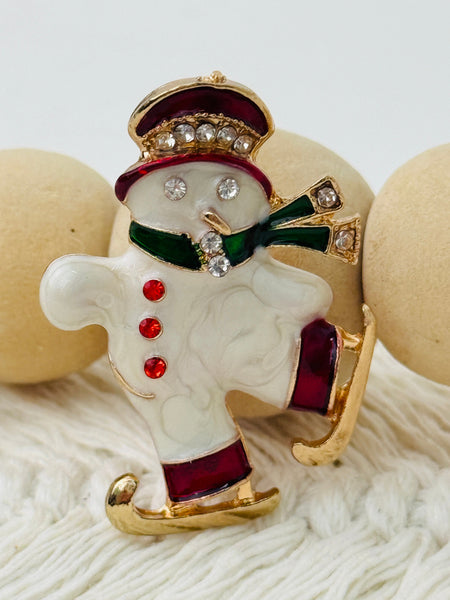 Festive skating snowman brooch with green scarf 