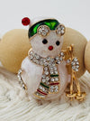 close-up of christmas snowman brooch with crystal effect details