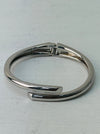 A sleek silver bracelet with a modern open-ended design, displayed on a white background.