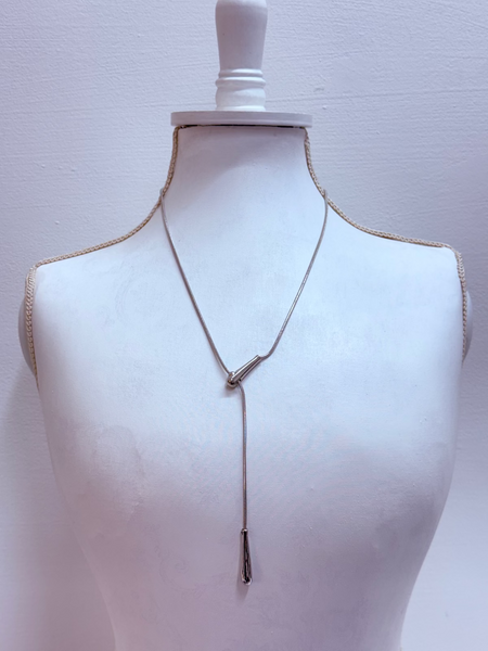 silver sliding chain necklace on a mannequin