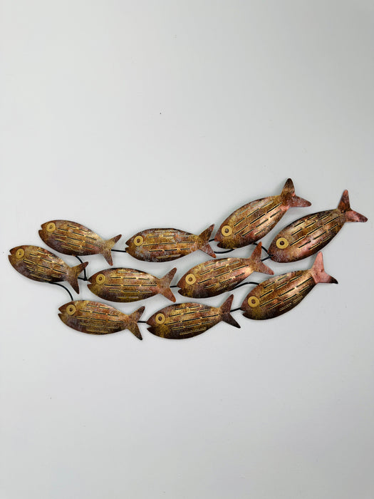 Small copper mottled metal fish shoal wall art with 10 fish on a white background