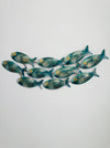 Small mottled aqua metal fish shoal wall art with 10 fish on a white background