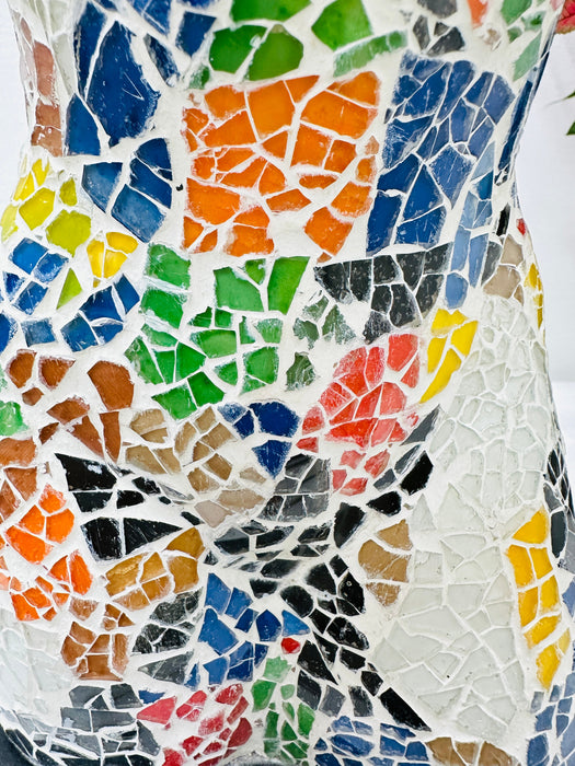 Close-up of hand-painted crackle mosaic glass in rainbow tones.
