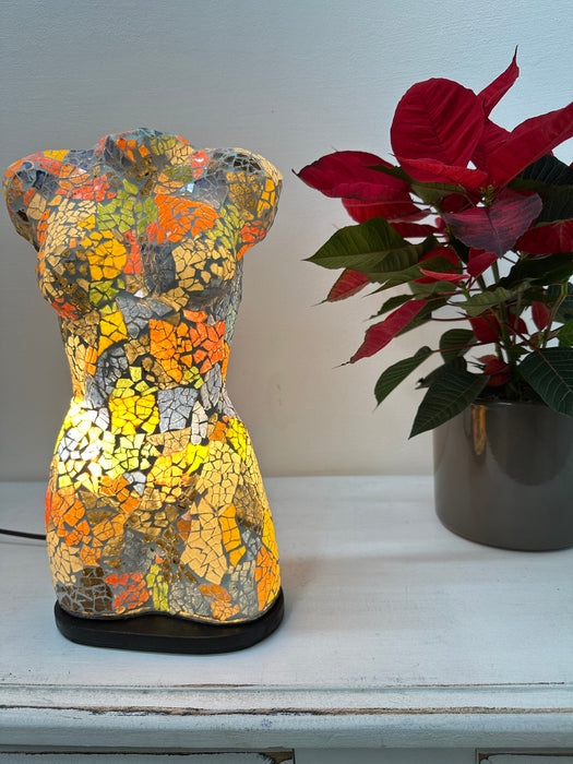 Small mosaic bust lamp illuminated in warm light, showcasing vibrant crackle glass colours.