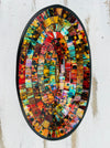 Top view of handmade oval mosaic bowl in Calypso tones showing bright, colourful glass pattern on terracotta base.