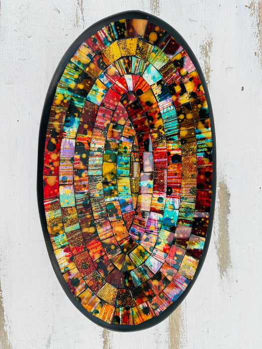 Top view of handmade oval mosaic bowl in Calypso tones showing bright, colourful glass pattern on terracotta base.