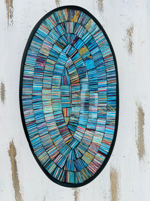Top view of handmade oval mosaic bowl in Miami tones showing shimmering turquoise and silver mosaic design on terracotta base.
