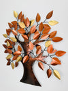 Angled view of metal oak tree wall art showing leaf texture and warm colours